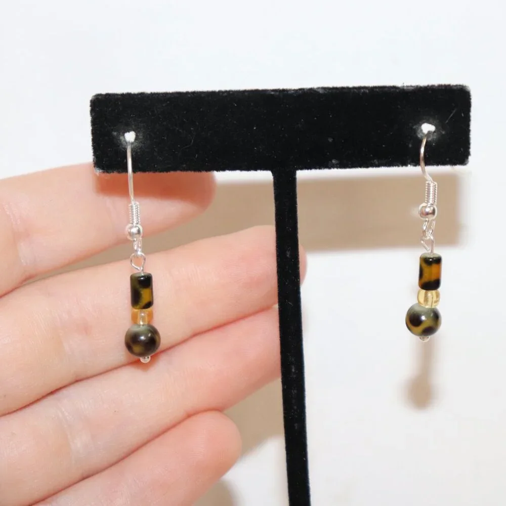 Beautiful NWOT Silver, animal print and yellow dangle earrings 1.5